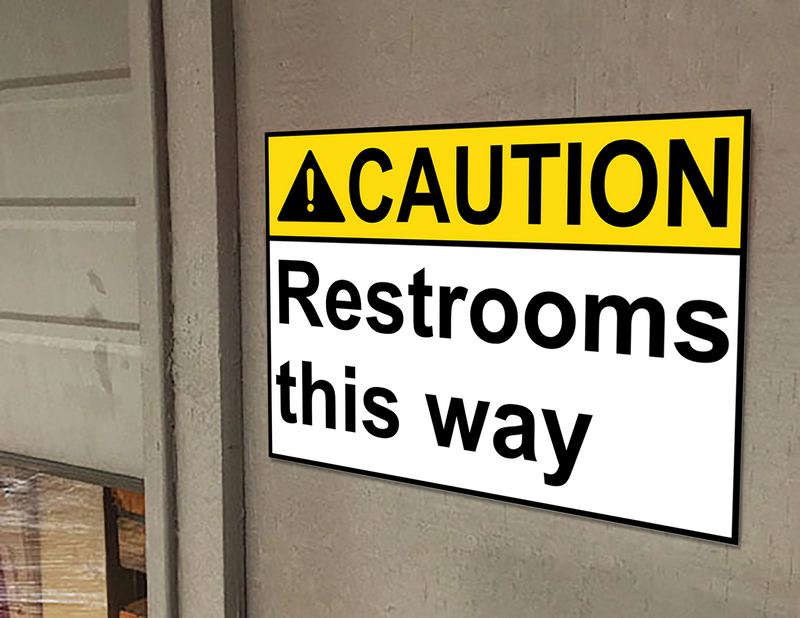ANSI CAUTION Restrooms this way Sign